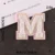 M